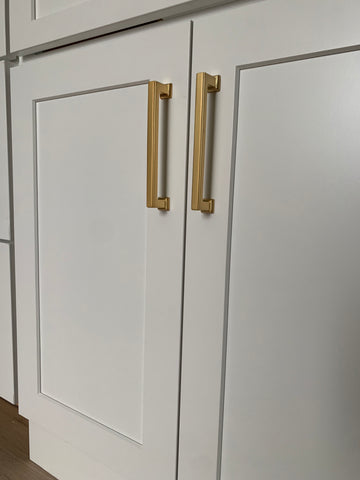 satin brass cabinet pull on white cabinet